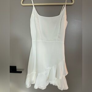 Lulu’s white satin ruffle mini dress.